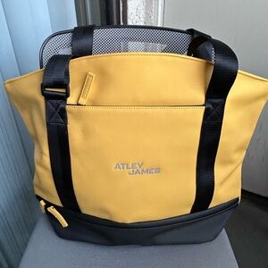 ATLEY JAMES 2 pc set Sunshine yellow and black duffel & matching cosmetic case.